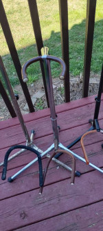 Four old guitar stands