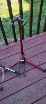 Four old guitar stands