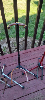 Four old guitar stands