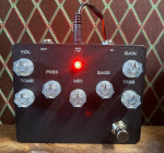 3 drive pedals, EQ, Tuner, pedalboard