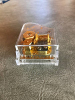 Acrylic tiny musical piano plays Memory