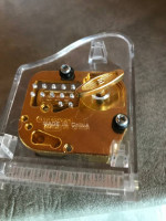Acrylic tiny musical piano plays Memory