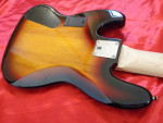 2012 Squier Deluxe Active V Sunburst Jazz Bass Guitar.