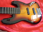 2012 Squier Deluxe Active V Sunburst Jazz Bass Guitar.
