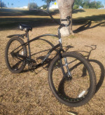 Men's Electra Cruiser 26-inch wheels and green lights in rims