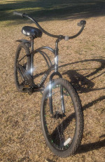 Men's Electra Cruiser 26-inch wheels and green lights in rims