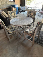Nice wood patio table with 4 chairs and pads