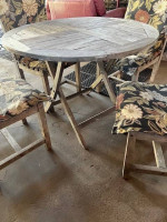 Nice wood patio table with 4 chairs and pads