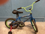 Toddler with training wheels