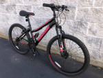 24" Mongoose 21-speed hardtail mountain bike for ages 7 to 11