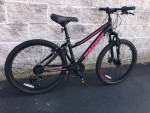 24" Mongoose 21-speed hardtail mountain bike for ages 7 to 11