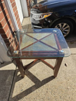 Glass top side table with slate tile under glass