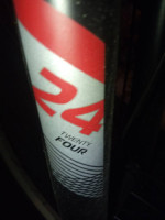 24 Huffy with Bag And Light plus unopened pad lock for bike. Gray/blk