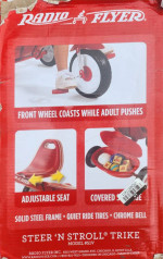 A New in the box radio flyer tricycle