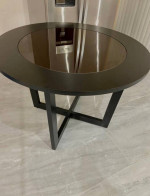round wooden table with glass