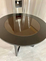 round wooden table with glass