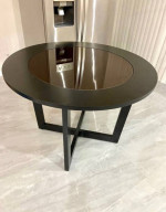 round wooden table with glass
