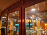 Woodgrain Dining Table with Lighted China and Chairs