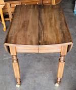 Oval drop leaf table on wheels