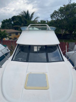 1997 Bayliner Ciera 2858 Flybridge with a triple axle aluminum trailer