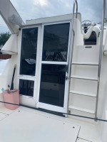 1997 Bayliner Ciera 2858 Flybridge with a triple axle aluminum trailer
