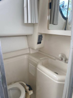 1997 Bayliner Ciera 2858 Flybridge with a triple axle aluminum trailer