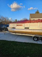 Pontoon boat,motor and trailer