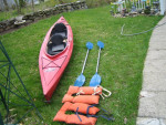 16 ft. Red Old Town Tandem Kayak.has paddles and rudder.