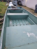 12 ft Lund flat bottom boat with 2019 trailer and 4 horse outboard