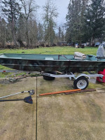 12 ft Lund flat bottom boat with 2019 trailer and 4 horse outboard