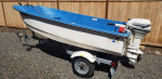 Livingston Boat with 9.9 hp engine and trailer