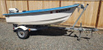 Livingston Boat with 9.9 hp engine and trailer