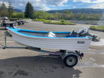 10” Hi-Laker fiberglass boat on an ez-loader galvanized trailer
