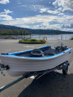 10” Hi-Laker fiberglass boat on an ez-loader galvanized trailer
