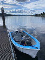10” Hi-Laker fiberglass boat on an ez-loader galvanized trailer