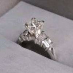 DIAMOND ENGAGEMENT RING IN PLATINUM SETTING W/SIDE BAGUETTES