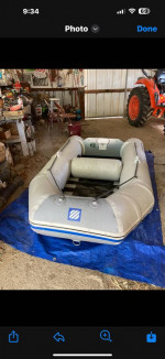 Zodiac and motor by West Marine