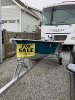 12' Aluminum boat and motor.