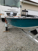 12' Aluminum boat and motor.