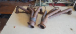 Headers with emission control