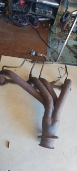 Headers with emission control