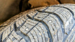 Four 255/60/R16 studded snow tires on universal alloy rims