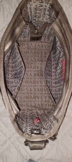 Harvey's twist clasp seatbelt hobo bag