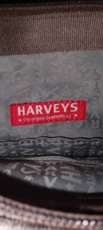 Harvey's twist clasp seatbelt hobo bag