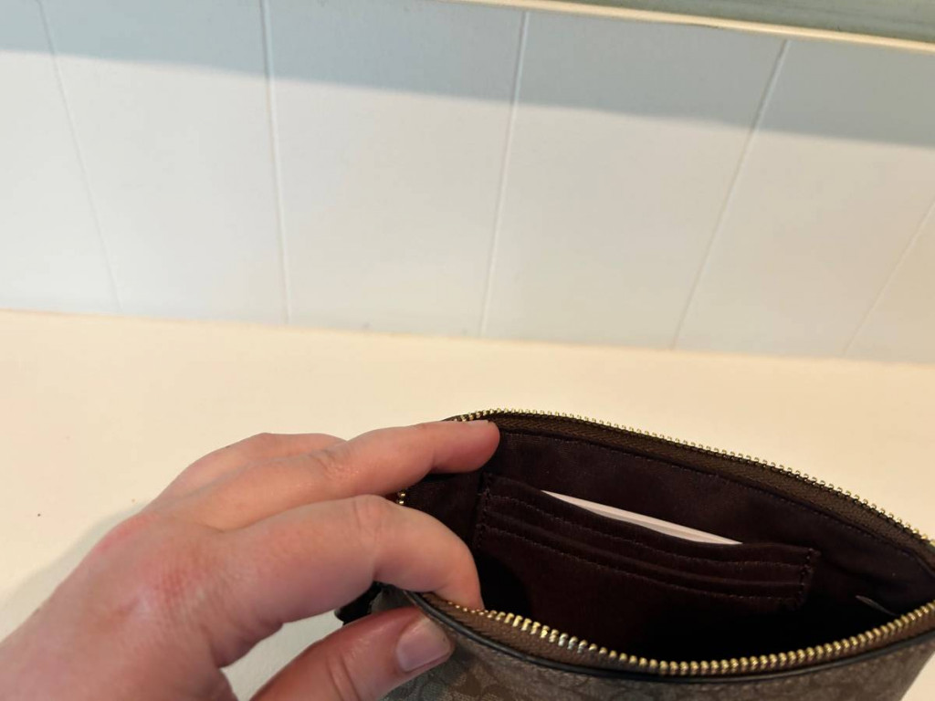 Coach Corner Zip Wristlet In Signature Canvas