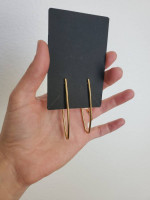 Gold-tone elongated open hoop earrings