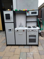 Child's black and silver wooden kitchen with accessories