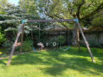 Custom built, pressure treated solid wood 3-swing swing set