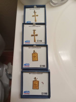 Four 14k gold pendants