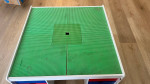 Lego table with 2 boxes of Legos and 2 chairs